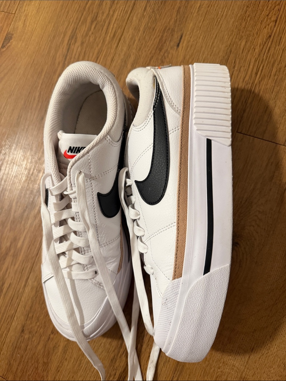 Nike White Sneakers with Black Swoosh and Tan Accent platform